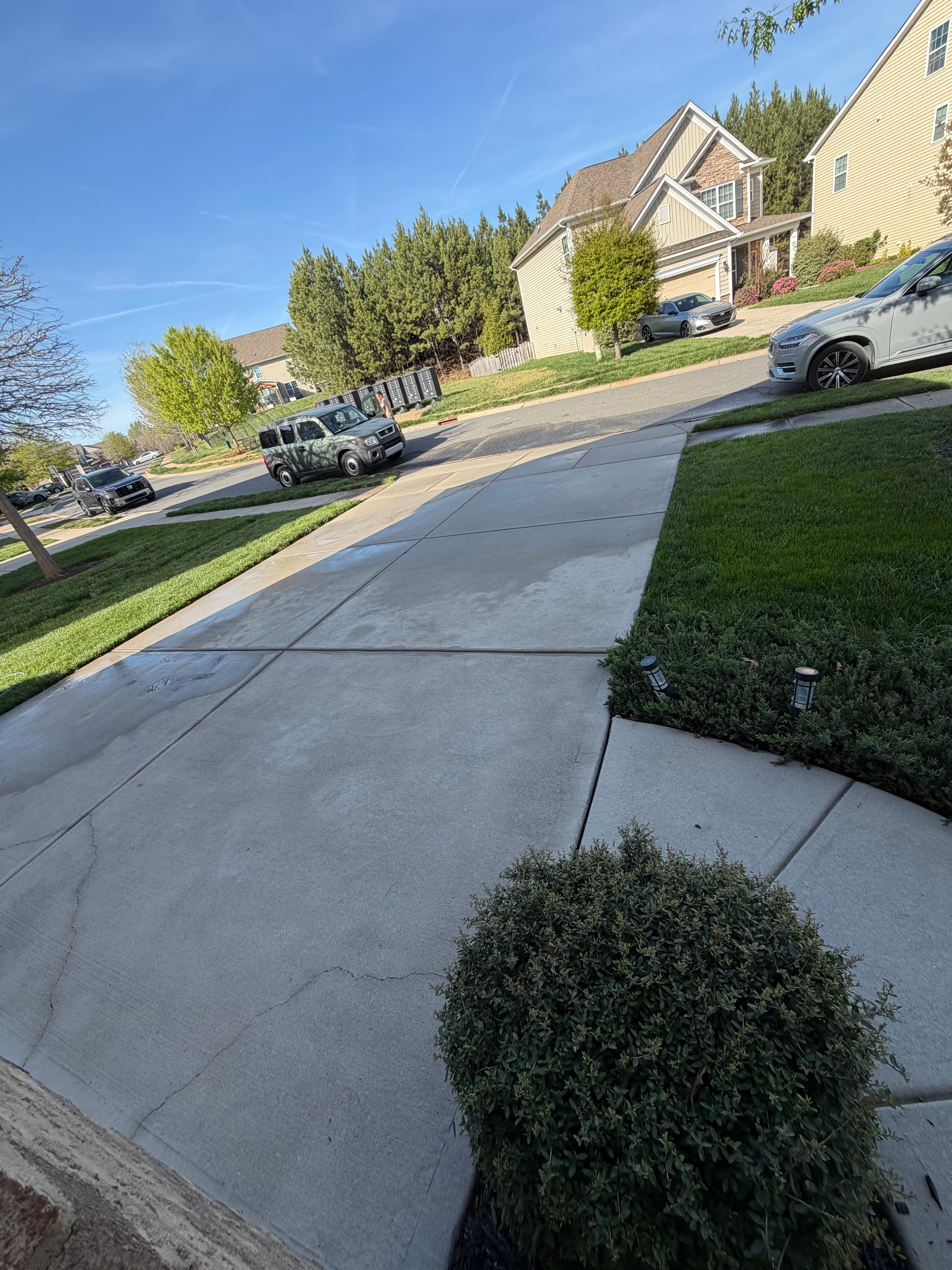 After — Concrete driveway pressure washing in Huntersville, NC