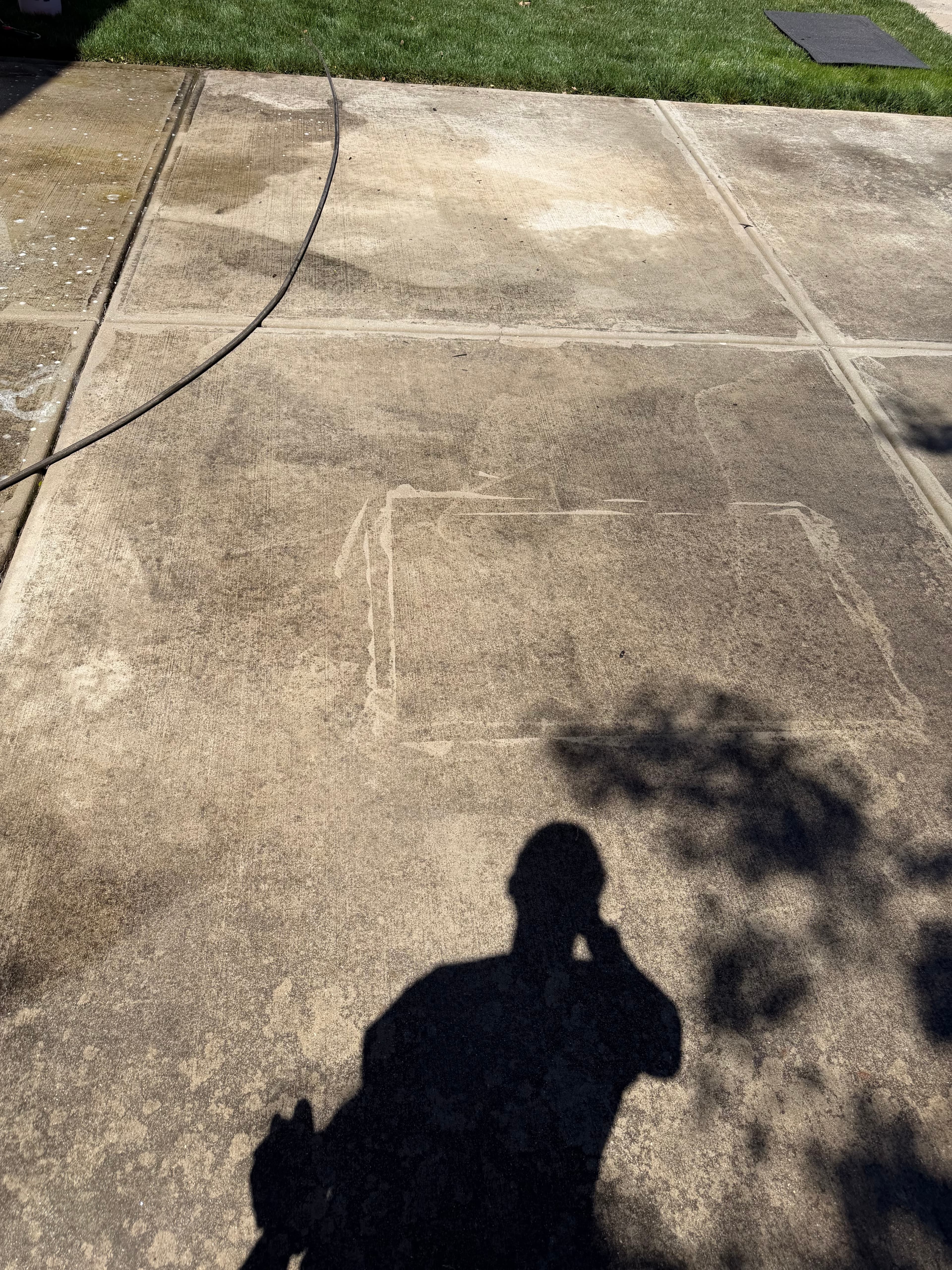 Before — Concrete driveway pressure washing in Huntersville, NC